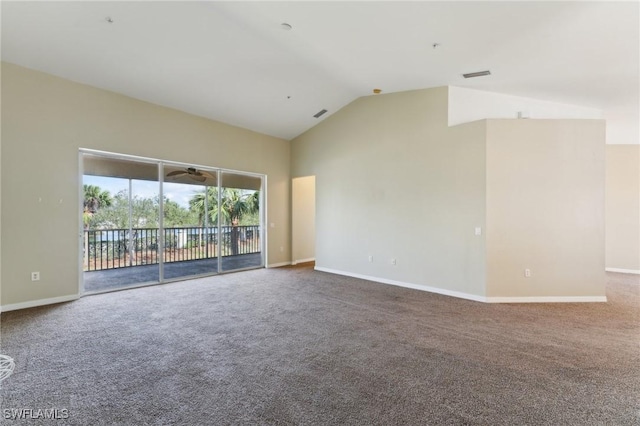 carpeted empty room featuring high vaulted ceiling