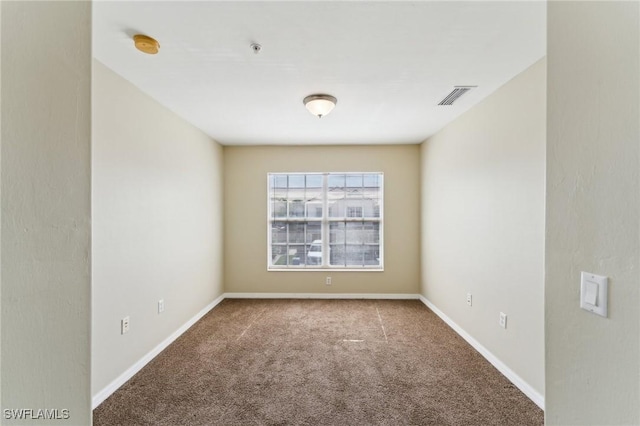 empty room featuring carpet floors