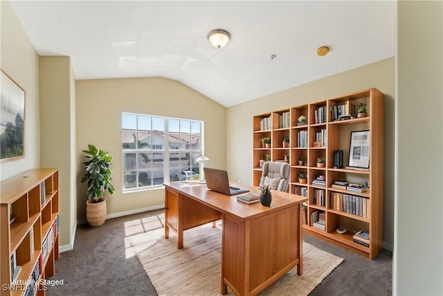 office area with vaulted ceiling and carpet flooring