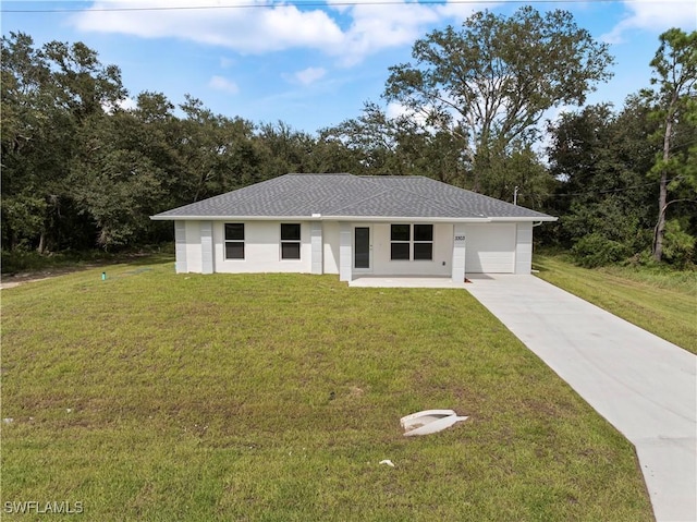 single story home with a garage and a front yard