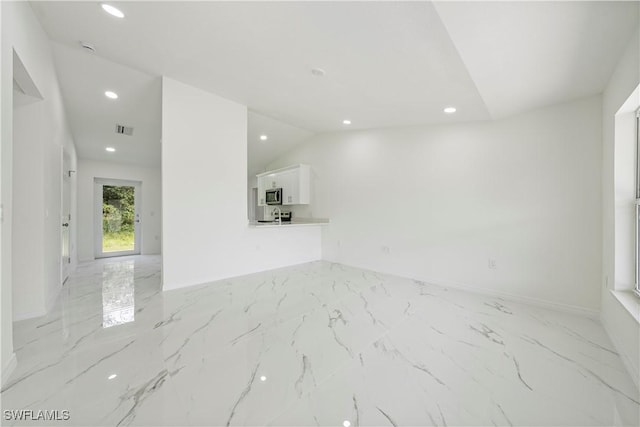 unfurnished living room featuring lofted ceiling, recessed lighting, visible vents, baseboards, and marble finish floor