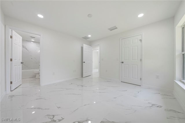 unfurnished bedroom featuring marble finish floor, visible vents, baseboards, and recessed lighting