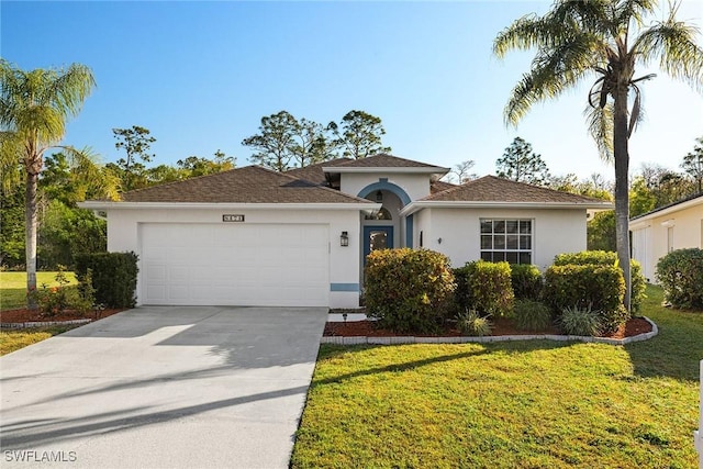 view of front of home with a garage and a front lawn