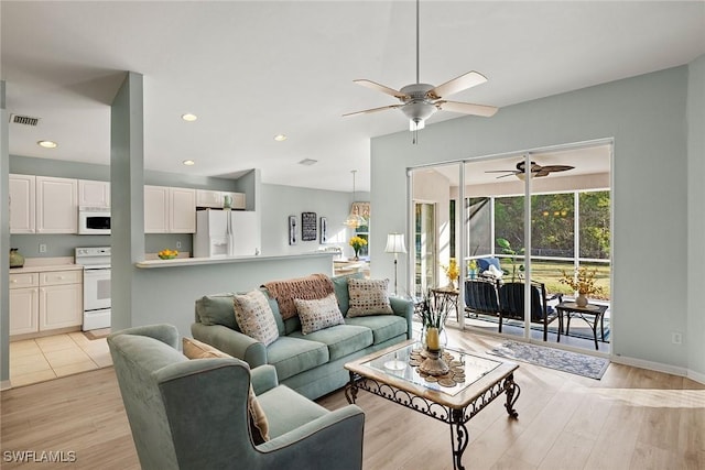 living room with light hardwood / wood-style floors