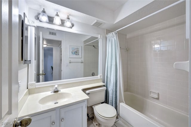 full bathroom featuring vanity, shower / bath combo, and toilet