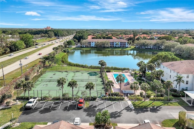 birds eye view of property with a water view