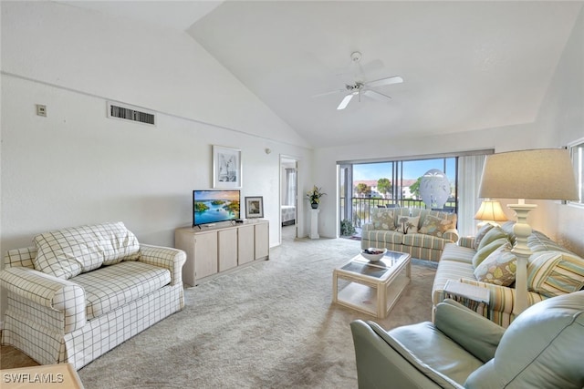 carpeted living room with high vaulted ceiling and ceiling fan