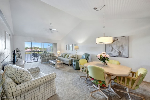 living room featuring ceiling fan, high vaulted ceiling, and carpet