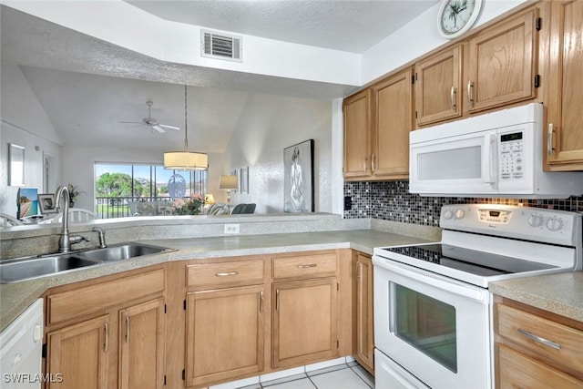 kitchen with sink, white appliances, light tile patterned floors, ceiling fan, and tasteful backsplash