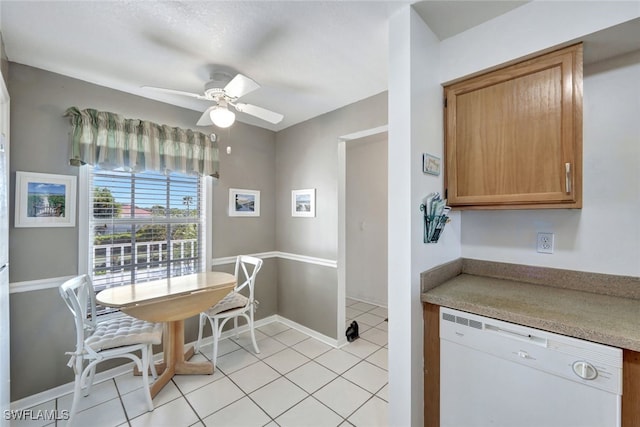 kitchen featuring light tile patterned flooring, ceiling fan, and white dishwasher