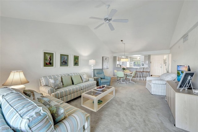 living room featuring light carpet, high vaulted ceiling, and ceiling fan