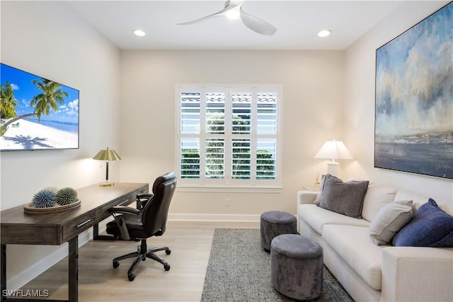 office space featuring ceiling fan and light hardwood / wood-style flooring