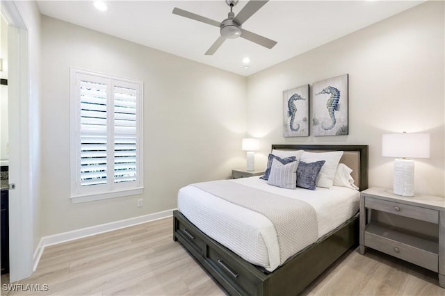 bedroom featuring ceiling fan and light hardwood / wood-style flooring