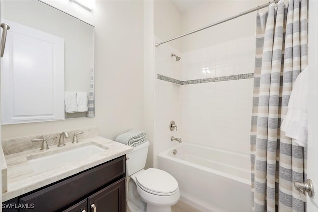 full bathroom featuring vanity, shower / tub combo with curtain, and toilet