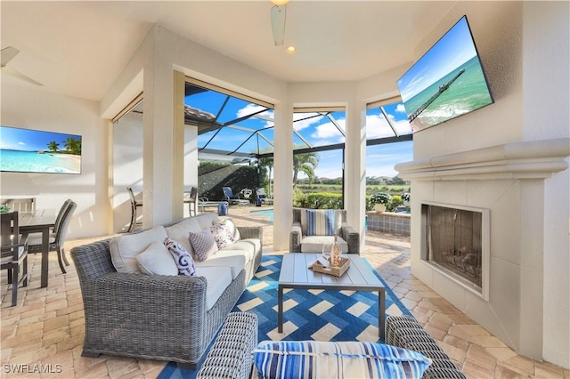 living room with a tiled fireplace