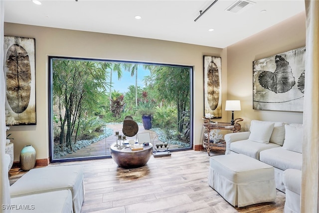 sitting room featuring light hardwood / wood-style floors