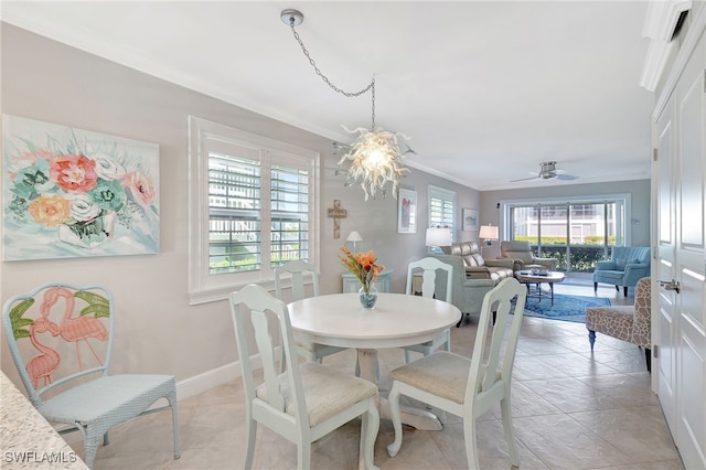 dining space featuring ornamental molding and ceiling fan with notable chandelier