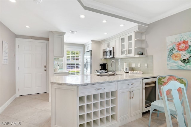 kitchen with white cabinetry, appliances with stainless steel finishes, and sink