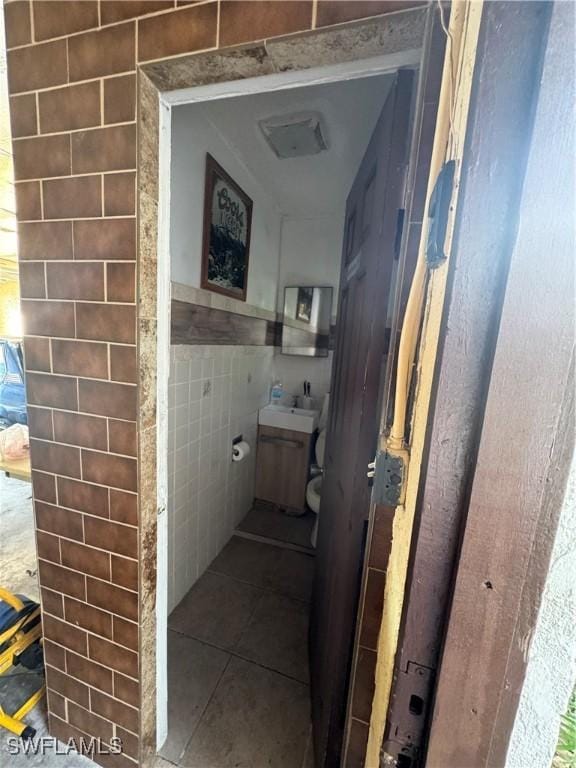 bathroom featuring tile walls and tile patterned flooring