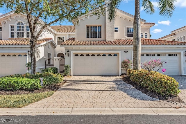 mediterranean / spanish-style house featuring a garage