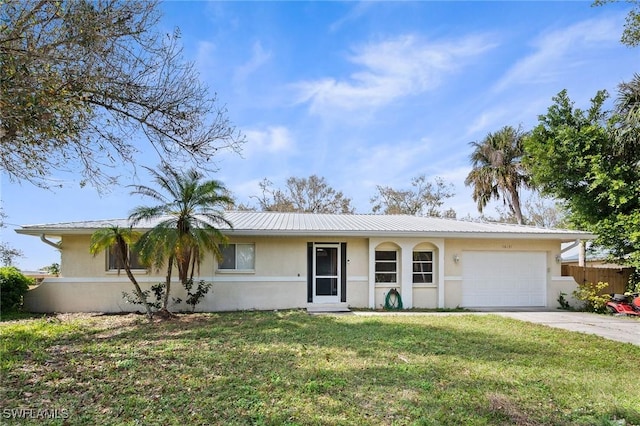 ranch-style house featuring a garage and a front lawn