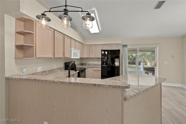 kitchen featuring light stone counters, black appliances, kitchen peninsula, and light brown cabinets