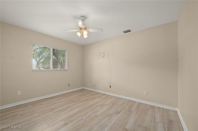 unfurnished room featuring light hardwood / wood-style floors and ceiling fan