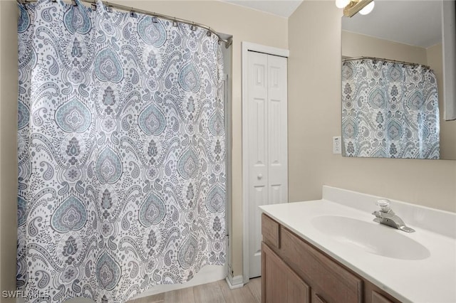 bathroom featuring vanity and walk in shower