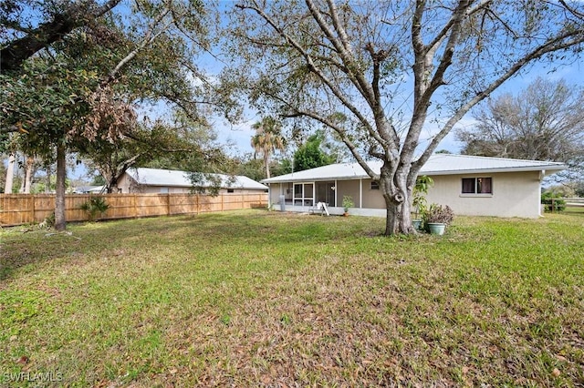 view of yard with a sunroom