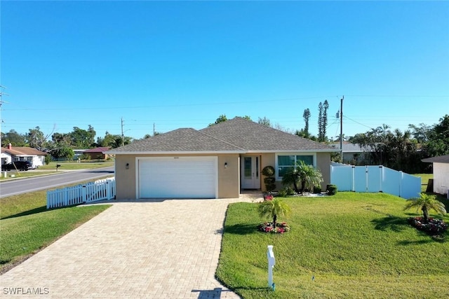 single story home with a garage and a front yard