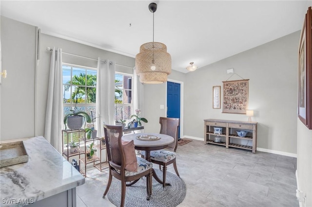 dining area featuring lofted ceiling