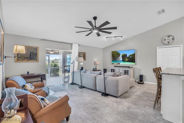 living room featuring ceiling fan and vaulted ceiling