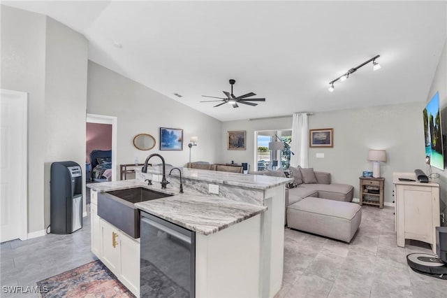 kitchen with sink, white cabinetry, vaulted ceiling, a center island with sink, and dishwasher