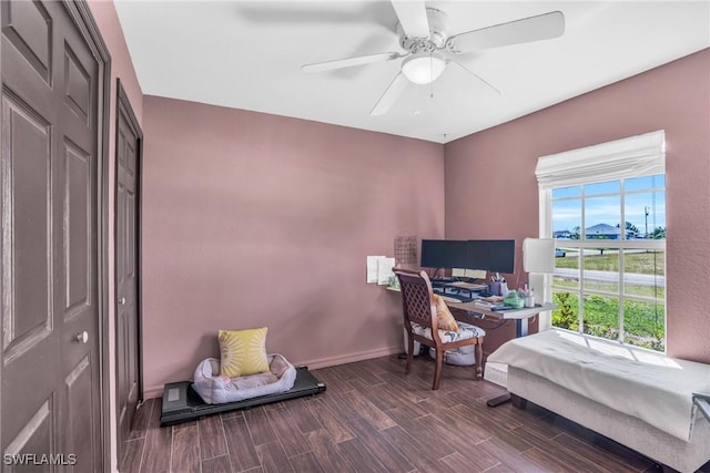 office featuring dark hardwood / wood-style floors and ceiling fan