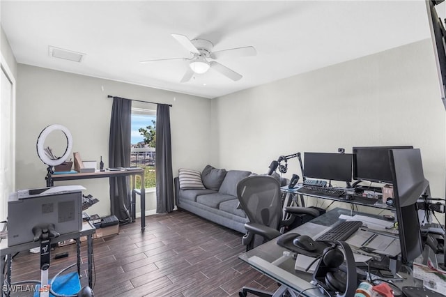 office area with ceiling fan and dark hardwood / wood-style flooring