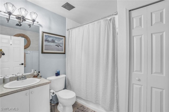 full bathroom featuring vanity, shower / tub combo, and toilet