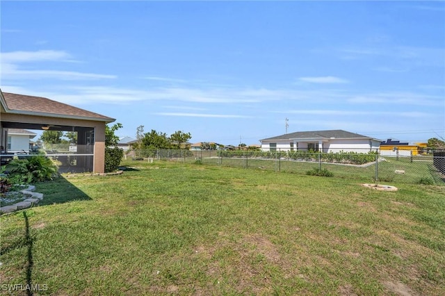 view of yard featuring a sunroom