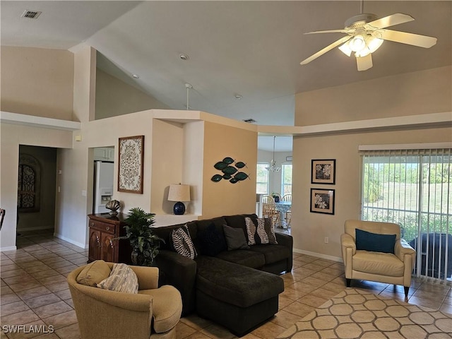 tiled living room featuring high vaulted ceiling and ceiling fan