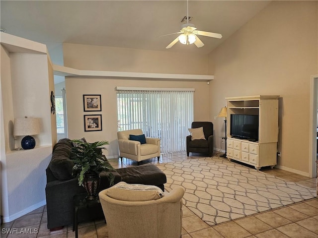 living room with high vaulted ceiling, light tile patterned floors, and ceiling fan