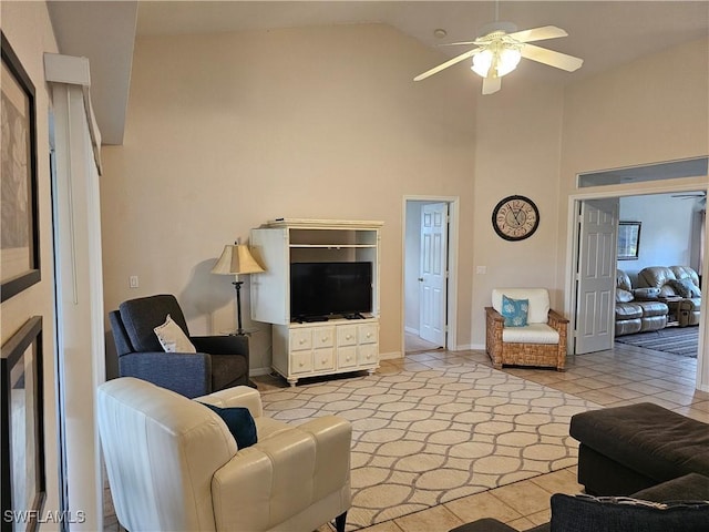 tiled living room with high vaulted ceiling and ceiling fan