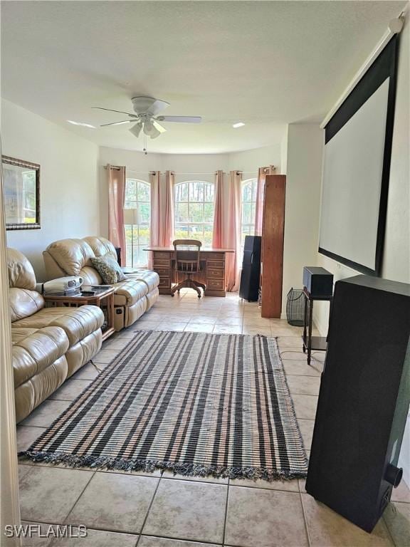 living room with light tile patterned flooring and ceiling fan