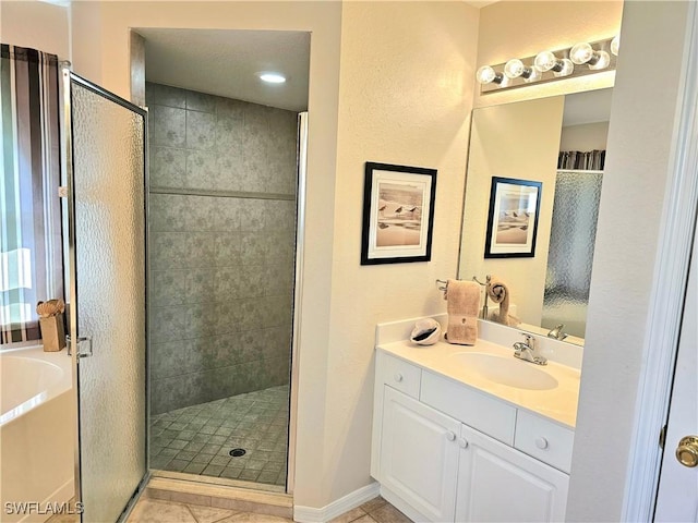 bathroom featuring vanity, tile patterned flooring, and a shower with door