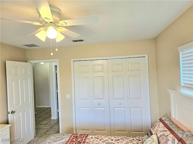 unfurnished bedroom featuring a closet, ceiling fan, and light tile patterned flooring