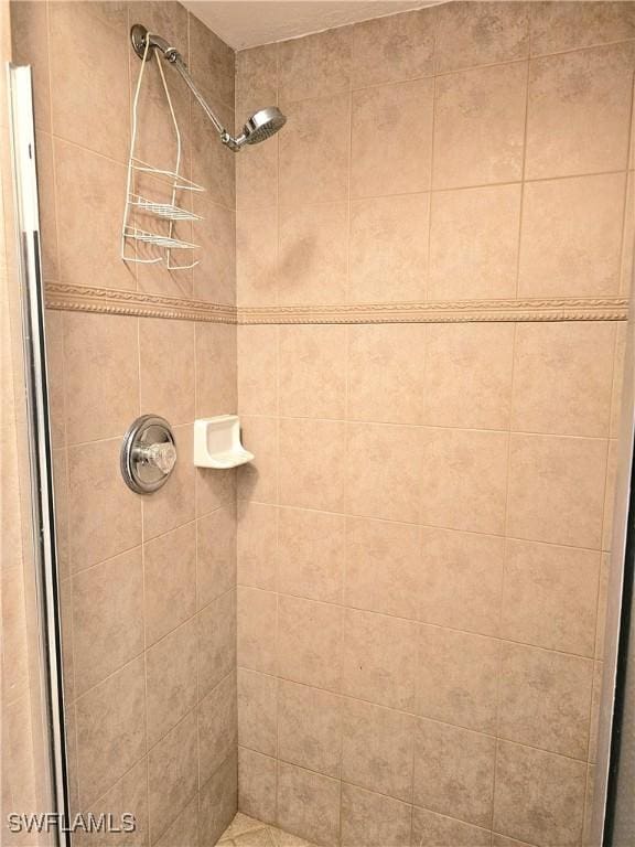 bathroom with tiled shower