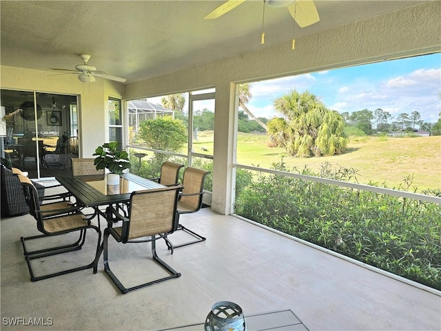 sunroom / solarium with ceiling fan