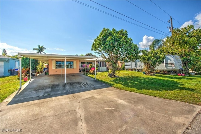 view of front of house featuring a front yard and a carport