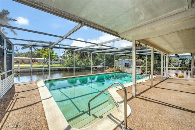 view of pool featuring a shed, a lanai, a patio area, and a water view