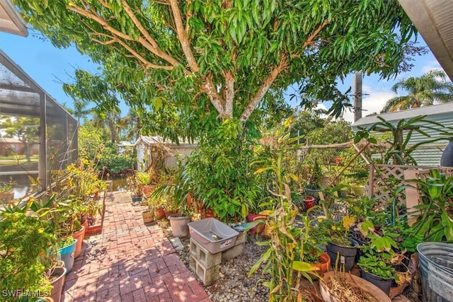 view of patio / terrace with a lanai