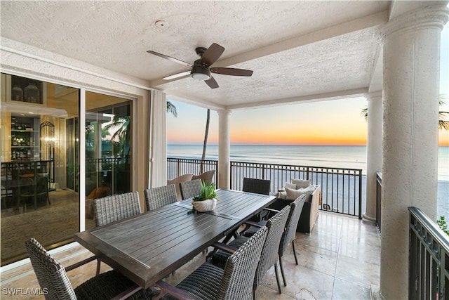 exterior space featuring a water view and ceiling fan