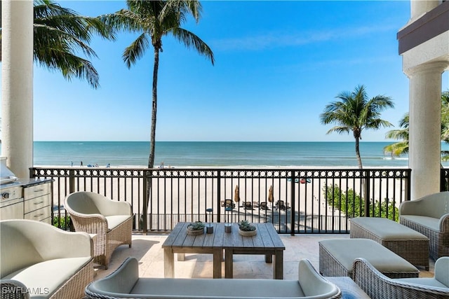 balcony with a view of the beach and a water view